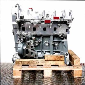 Side view of engine with code 199 B1.000 on a wooden pallet against a white background. The grey and silver engine features numerous details and red accents.