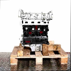 A 20 DTH engine on a wooden pallet against a white background. Side view of the silver and black engine.