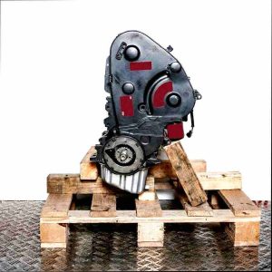 Side view of an AFN engine on a wooden pallet against a white background. The engine features a black cover and a visible gear.
