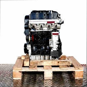 Black and silver BMM engine on a wooden pallet against a white background. The engine is shown vertically.