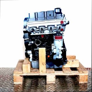 Side view of the BRS engine on a wooden pallet against a white background. The engine, primarily black and gray, displays various components and connections.