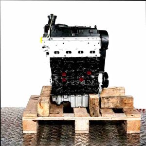 CAAB engine on a wooden pallet against a white background. The black and silver engine with yellow accents is viewed from the front.