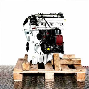 Side view of a black and silver CAHB engine on a wooden pallet against a white background. The engine is fully visible and vertically oriented.