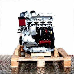Side view of a CDAB engine on a wooden pallet against a white background.