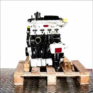 Side view of the CDLA engine on a wooden pallet against a white background. The engine, partially black and silver, is fully visible.
