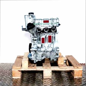 CGPA engine on a wooden pallet against a white background. The silver engine with black oil filter is viewed from the side.
