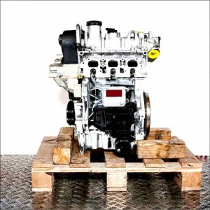 CHZC engine on a wooden pallet against a white background. The silver engine with black plastic components is vertically oriented.