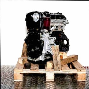CJKA engine on a wooden pallet against a white background. Side view of the engine, vertically oriented.