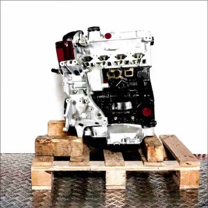 Side view of a CJKB engine on a wooden pallet against a white background. The engine, featuring black and silver components, is vertically oriented.