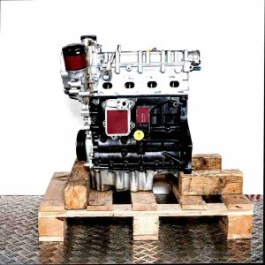 CNWB engine on a wooden pallet against a white background. The silver and black engine with filter is viewed from the side.