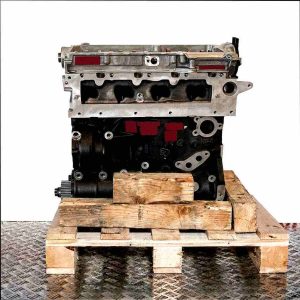 Side view of a black and silver engine (CUVC) on a wooden pallet. The engine is set against a white background.