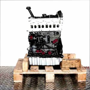 Side view of a CXHB engine on a wooden pallet against a white background. The engine features black, white, and yellow accents.