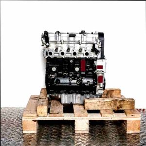 D4EA engine on a wooden pallet against a white background. The black and silver engine is photographed from the side.
