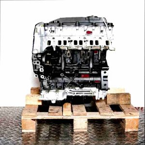 D4FA engine on a wooden pallet against a white background. The black and silver engine is viewed from the front.