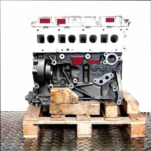 DAVA engine on a wooden pallet against a white background. Side view of the gray and black engine. No watermarks.