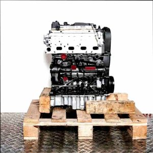 DBGA engine on a wooden pallet against a white background. The black and silver engine is viewed from the side.