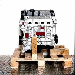 Side view of a DJKA engine on a wooden pallet against a white background. The engine is vertically oriented.