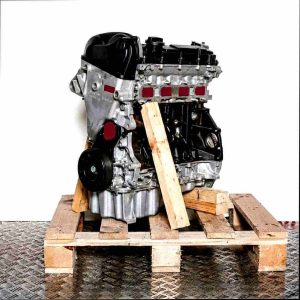 DLAC engine on a wooden pallet against a white background. Side view of the engine with a black cover and pulley.