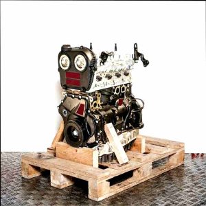 DNUA engine on a wooden pallet against a white background. Side view of the complete engine, angled slightly.
