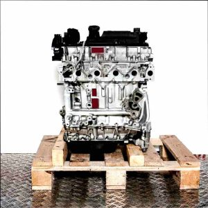 Side view of an F6JA engine on a wooden pallet against a white background. The engine is vertically oriented.
