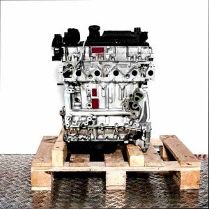 F6JB engine on a wooden pallet against a white background. Side view of the engine.