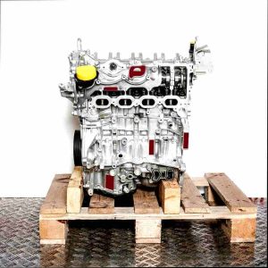 Silver engine H5H 470 on a wooden pallet against a white background. The engine with a yellow cap is viewed from the side.