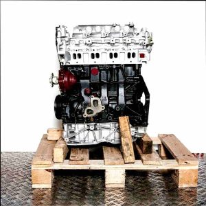 M9T 880 engine on a wooden pallet against a white background. The silver and black engine is viewed from the side.