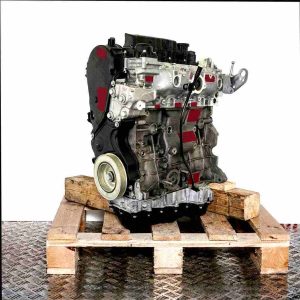 UFCB engine on a wooden pallet against a white background. Side view of the engine, no watermarks or logos.