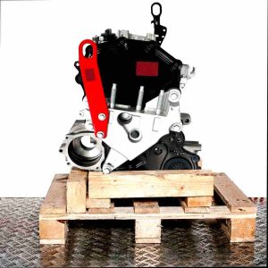 YLRA engine on a wooden pallet against a white background. Side view of the engine featuring red and black components and numerous screws.