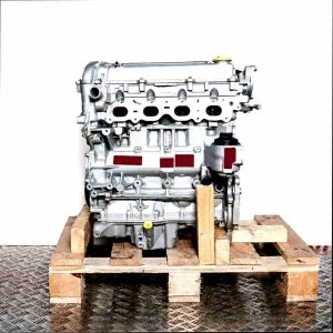 Side view of a Z 22 SE engine on a wooden pallet against a white background. The grey engine features various attachments and a yellow cap.